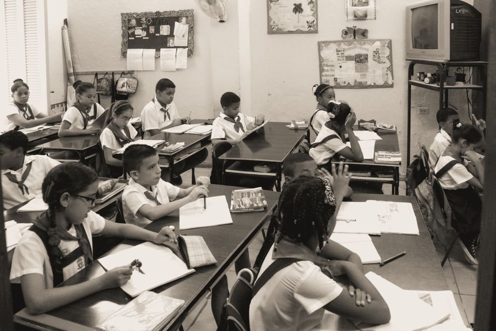 Illustrative classroom learning photograph from the original website